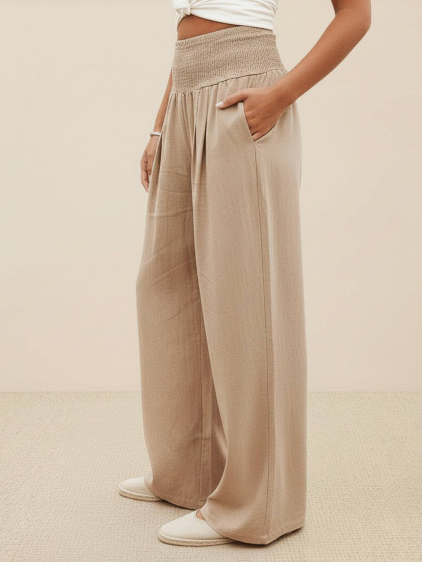 High-waist linen summer trousers for women by FJØRNA, wide-leg palazzo style with comfortable cotton fabric.