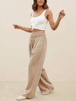 High-waist linen and cotton palazzo trousers for women by FJØRNA, featuring a wide-leg design and relaxed summer style.