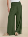 High-waist linen summer trousers for women by FJØRNA, wide-leg palazzo style, made of lightweight cotton and linen fabric.
