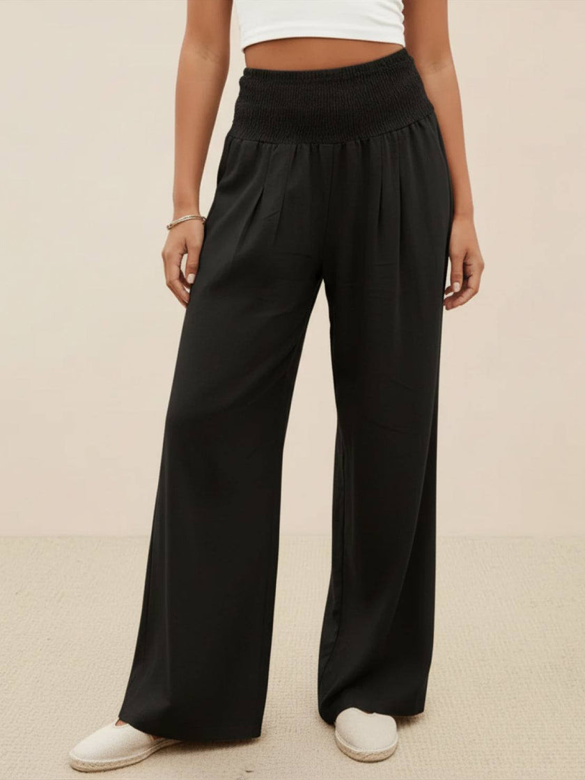 High-waist linen summer trousers for women by FJØRNA featuring wide-leg palazzo style and cotton fabric.