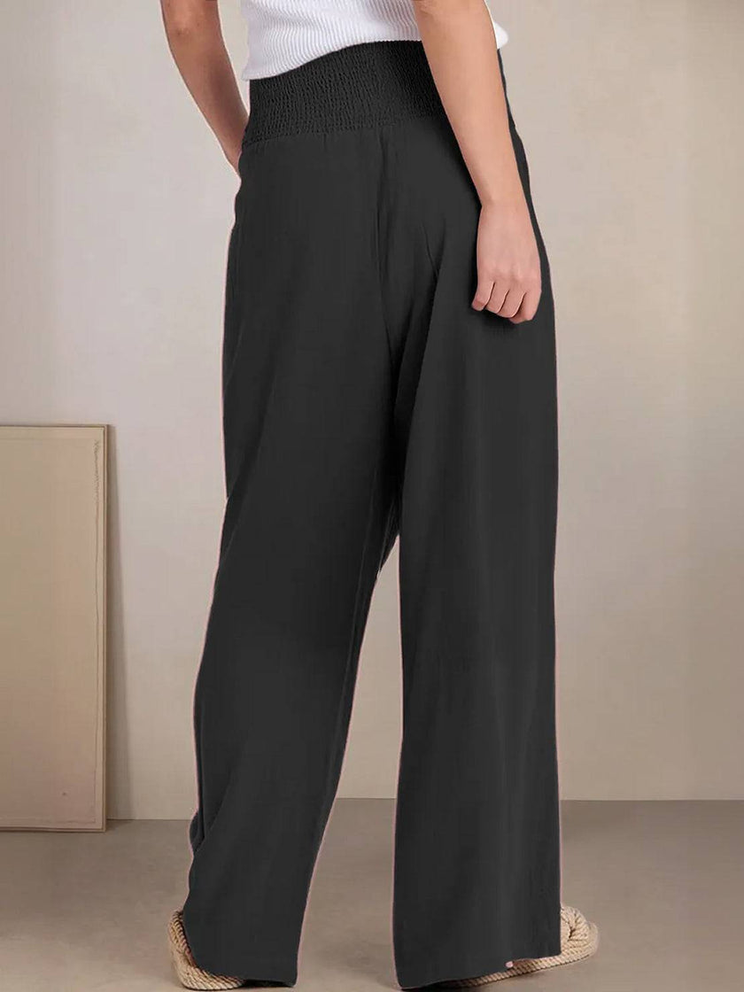 FJØRNA women's linen summer trousers with high waist and wide-leg palazzo style, made from cotton and linen fabric.