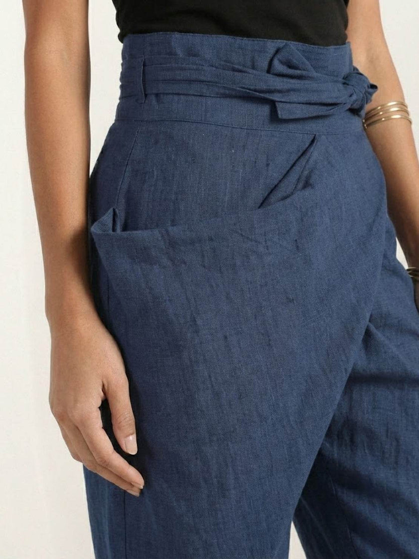 FJØRNA women's lightweight summer trousers with high waist, wide leg, and tapered fit, shown as comfortable, high-waisted wrapped pants.