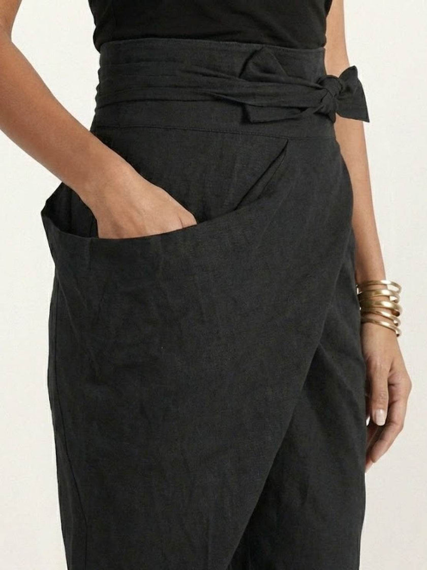 FJØRNA lightweight summer women's trousers with high-waist, wide-leg, tapered fit, and wrapped, comfortable fabric.