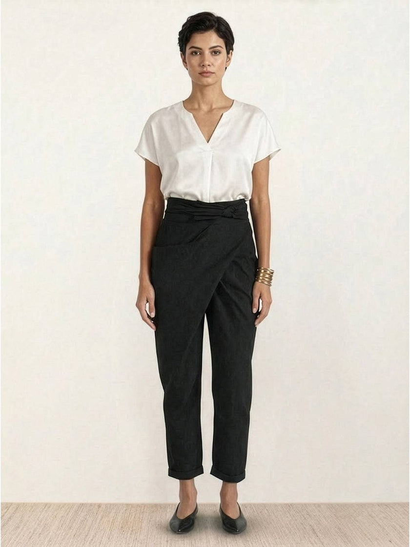 FJØRNA women's high-waist lightweight summer trousers with wide-leg and tapered fit, featuring a comfortable wrapped design.
