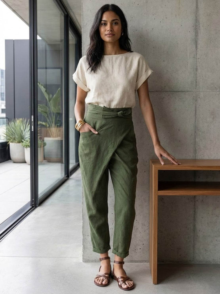 FJØRNA women's lightweight summer trousers with high waist, wide leg, and tapered design, made for comfortable, stylish wear.