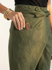 FJØRNA lightweight summer women's trousers with high waist, wide leg, and tapered fit, shown as comfortable high-waist wrapped pants.