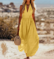 FJØRNA women's sleeveless bohemian cotton maxi dress with elegant resort style, flowing and comfortable for warm-weather wear.