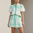 FJØRNA women's two-piece linen floral co-ord set featuring a matching top and skirt with a stylish, elegant design.