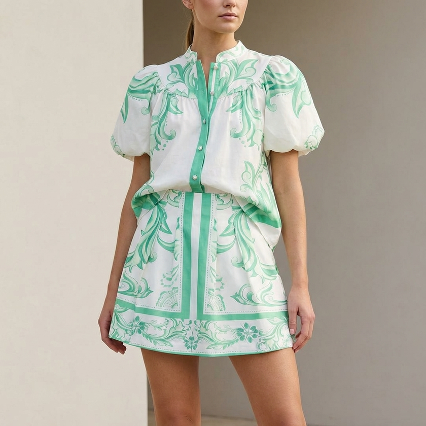 FJØRNA women's two-piece linen floral co-ord set featuring a matching top and skirt with a stylish, elegant design.