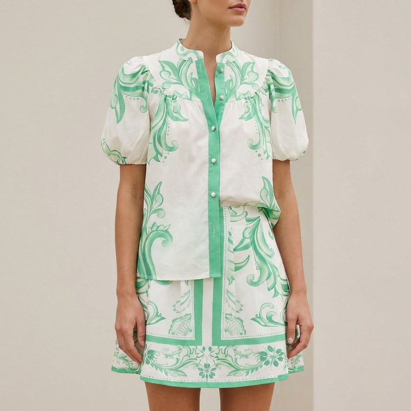 FJØRNA elegant two-piece women's linen floral co-ord set, featuring a matching top and skirt with a delicate floral pattern.