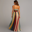 Back view of FJØRNA lightweight summer maxi dress for women with pleated ankle-length design and flowing fabric.