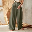 FJØRNA women's knit wide-leg trousers with elastic waistband, showcasing soft fabric and relaxed fit in neutral color.