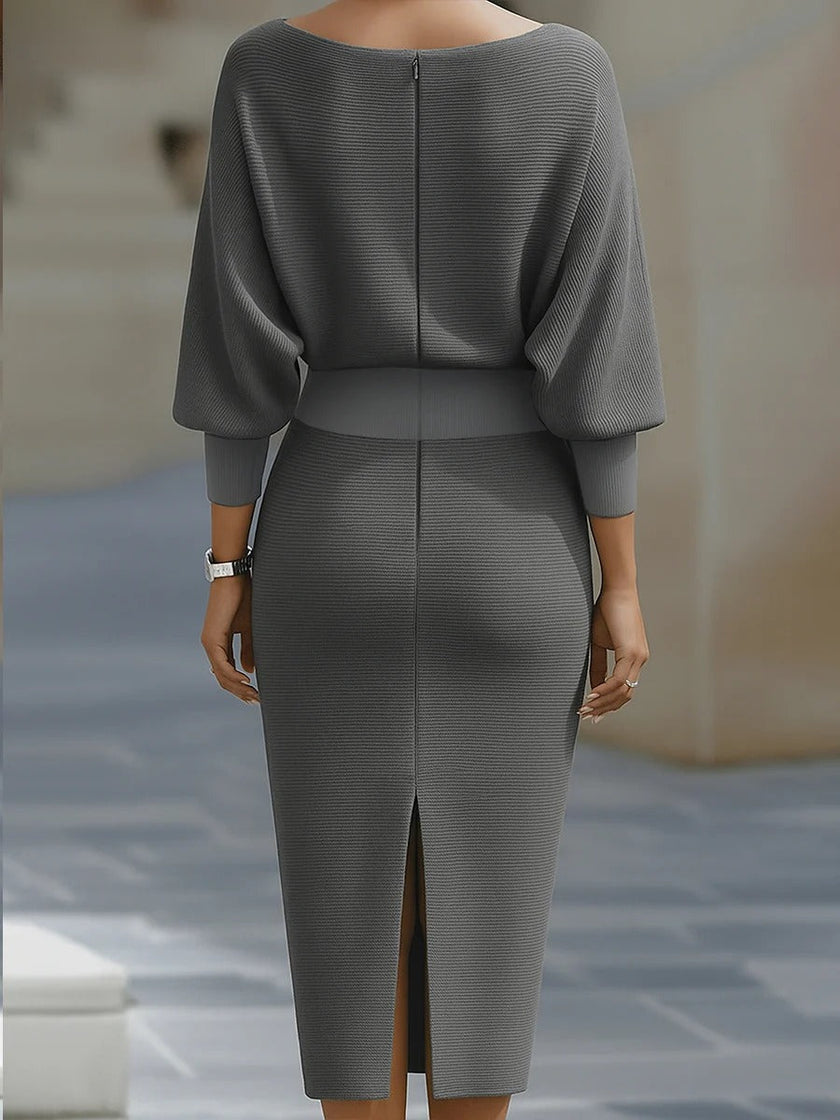 White FJØRNA dress with bat sleeves, waist-cinching design, and elegant, fashionable style in a pure color.