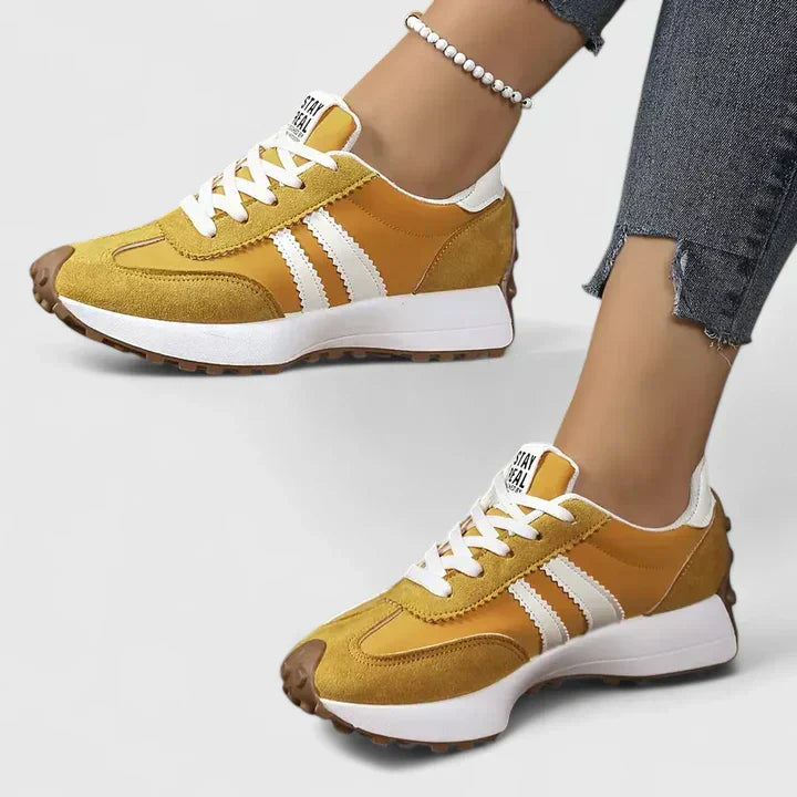 FJØRNA women's orthopedic sneakers with cushioned soles, stylish classic design, and supportive features for comfortable walking.