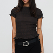 FJØRNA women's white plaid ruffle-detail blouse, stylish top with ruffles and plaid pattern, perfect for casual or dressy occasions