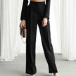 Lightweight women's summer trousers by FJØRNA, high-waisted wide-leg pleated pants, in a soft, flowy fabric ideal for warm weather.