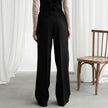 FJØRNA women's lightweight summer trousers with high waist, wide leg, and pleated design, shown in a neutral color.