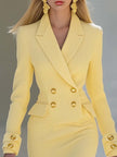 Yellow knit V-neck midi dress by FJØRNA, showcasing the soft fabric, V-shaped neckline, and elegant midi length of the evening dress.