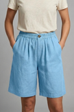 FJØRNA women's lightweight summer shorts with elastic waist, relaxed fit, breathable fabric, and functional pockets.