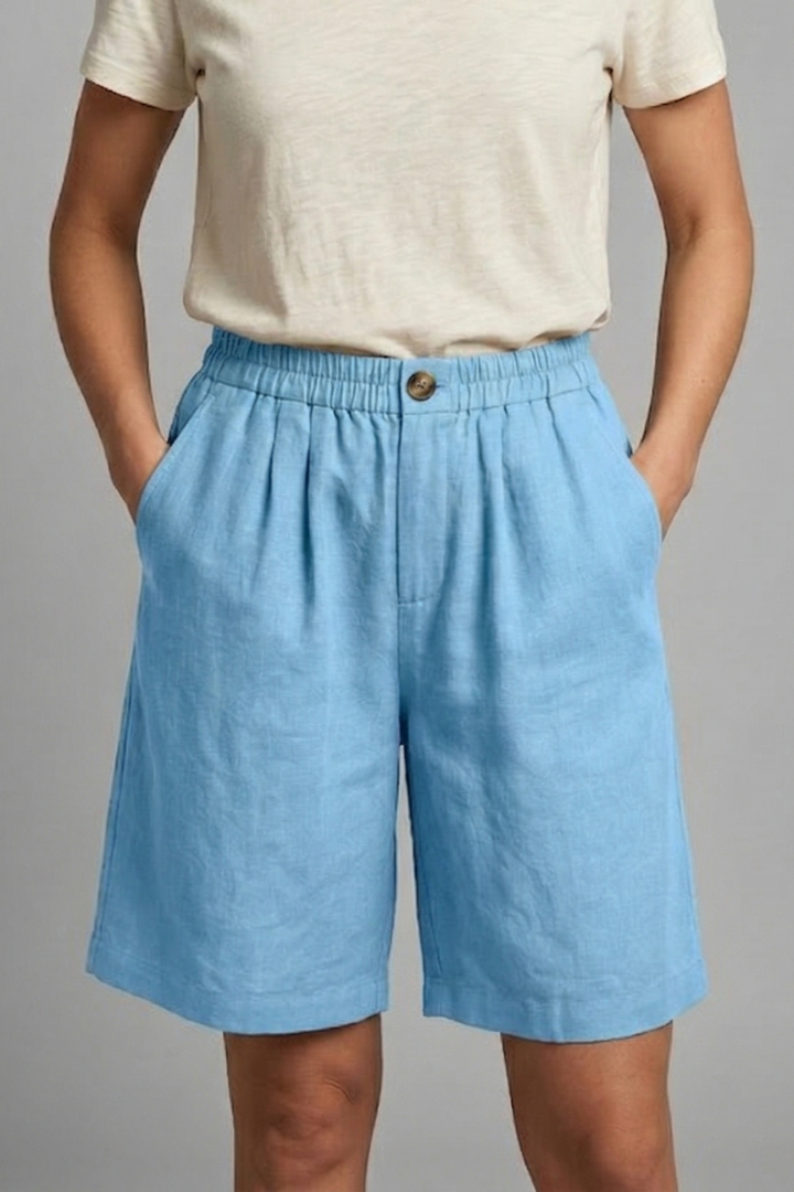 FJØRNA women's lightweight summer shorts with elastic waist, relaxed fit, breathable fabric, and functional pockets.