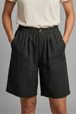 FJØRNA women's lightweight summer shorts with elastic waist, relaxed fit, breathable fabric, and side pockets.