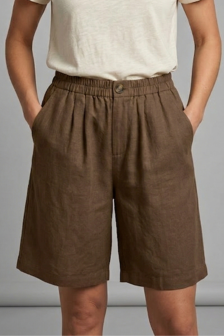 FJØRNA women's lightweight summer shorts with elastic waist, relaxed fit, breathable fabric, and side pockets.