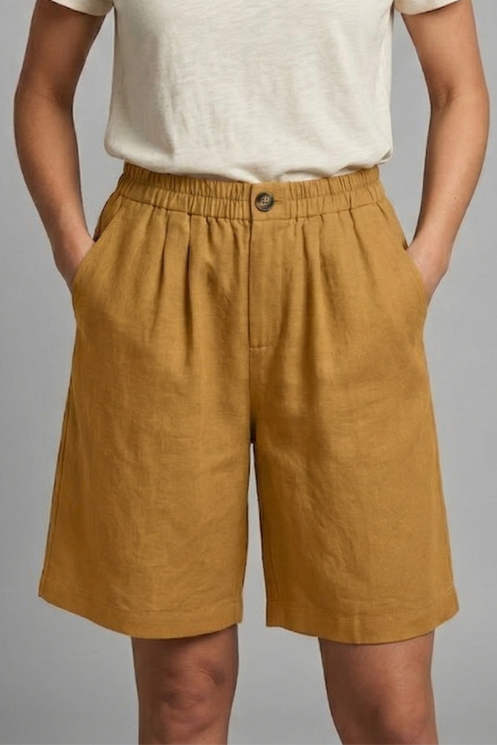 FJØRNA women's lightweight summer shorts with elastic waist, relaxed fit, breathable fabric, and side pockets.