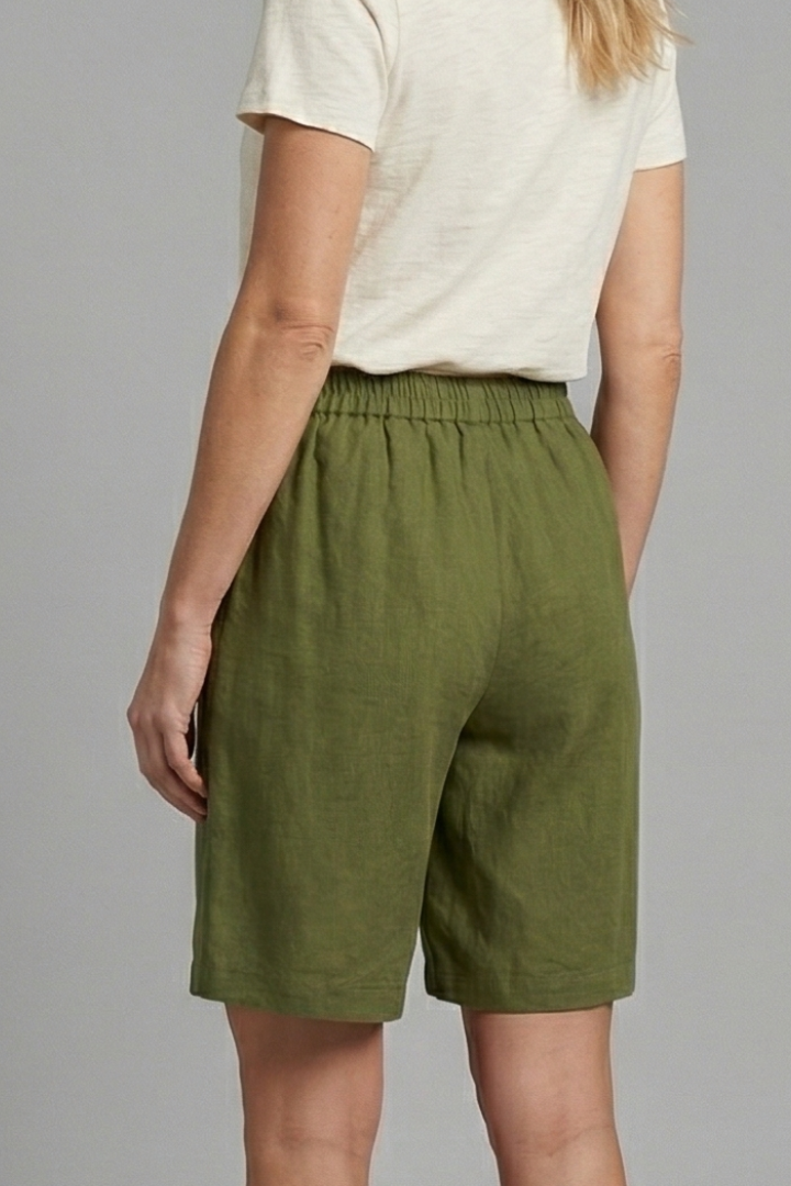 FJØRNA women's lightweight summer shorts with elastic waist, relaxed fit, breathable fabric, and front pockets.