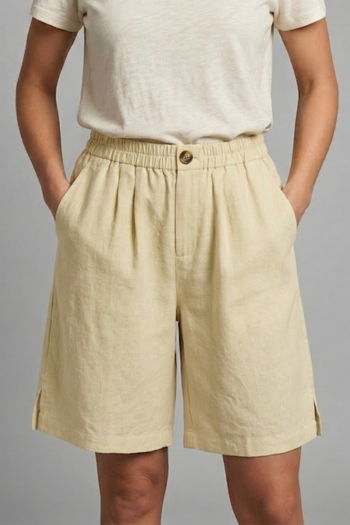 FJØRNA women's lightweight summer shorts with elastic waist, relaxed fit, breathable fabric, and side pockets.