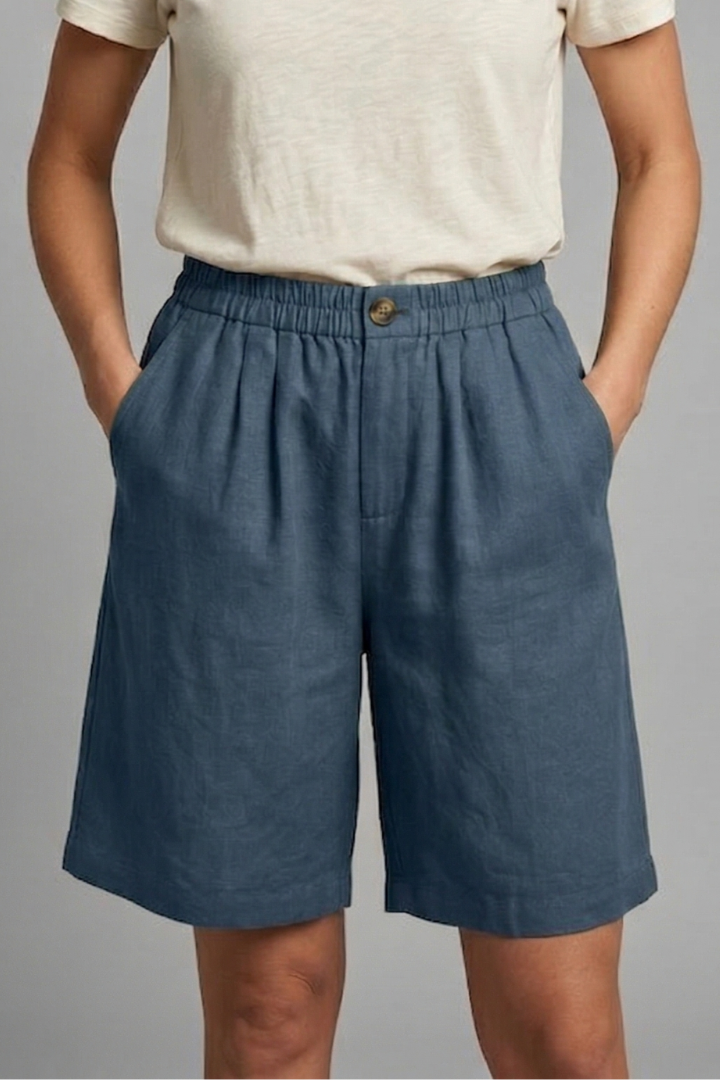 FJØRNA women's lightweight summer shorts with elastic waist, relaxed fit, breathable fabric, and side pockets.