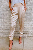 FJØRNA women's high waist cargo jogger pants, lightweight summer trousers with a relaxed fit and functional pockets.