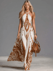 FJØRNA Off-White chiffon halter neck maxi dress with flowing fabric and casual style, perfect for warm weather or elegant casual wear.