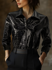 Black crocodile-texture glossy sleeveless leather shirt for women, stylish FJØRNA leather top with a sleek, shiny finish.