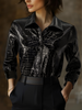 Black crocodile-texture glossy sleeveless leather shirt for women, stylish FJØRNA leather top with a sleek, shiny finish.