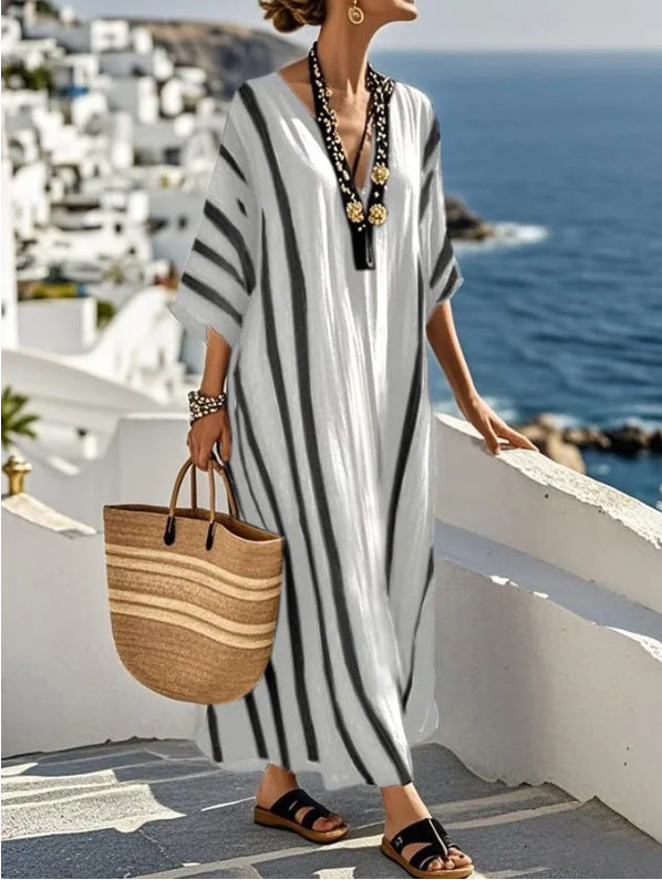 Women's loose summer kaftan dress by FJØRNA, flowing long style with relaxed fit, ideal for warm weather.