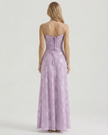 Lavender floral lace maxi dress for women by FJØRNA with spaghetti straps and sheer back, perfect for wedding guest attire.