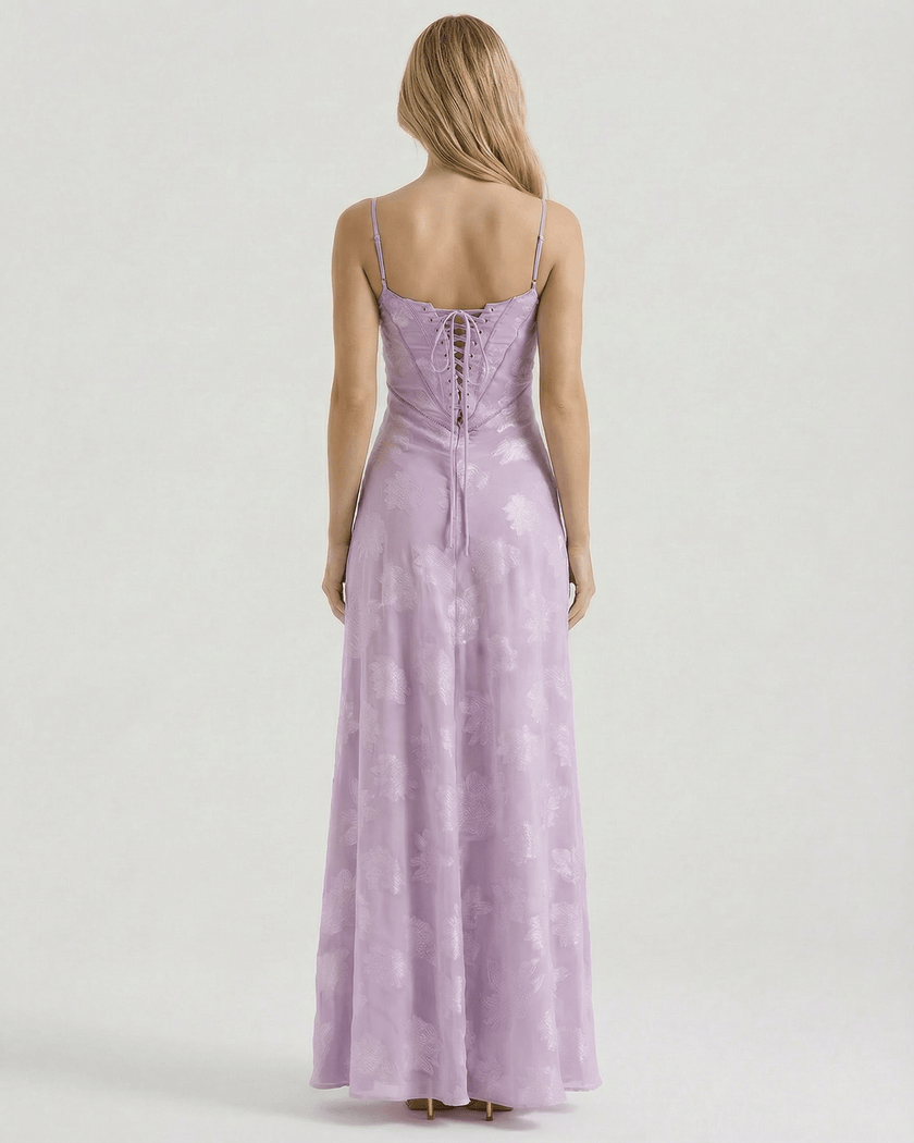 Lavender floral lace maxi dress for women by FJØRNA with spaghetti straps and sheer back, perfect for wedding guest attire.