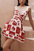 FJØRNA Leila printed cut-out mini dress in white, featuring a stylish design, short length, and vibrant pattern.