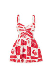 FJØRNA Leila printed cut-out mini dress in white, featuring a stylish design with cut-outs and floral print.