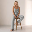 FJØRNA women's summer two-piece set with button front, scoop neck, casual style, worn by a woman outdoors in a lifestyle setting.