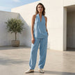 FJØRNA women's two-piece co-ord set with pockets and V-neck, suitable for summer, shown in a stylish lifestyle setting.