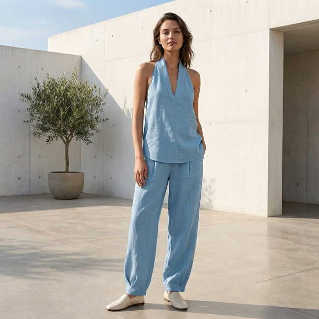 FJØRNA women's two-piece co-ord set with pockets and V-neck, suitable for summer, shown in a stylish lifestyle setting.