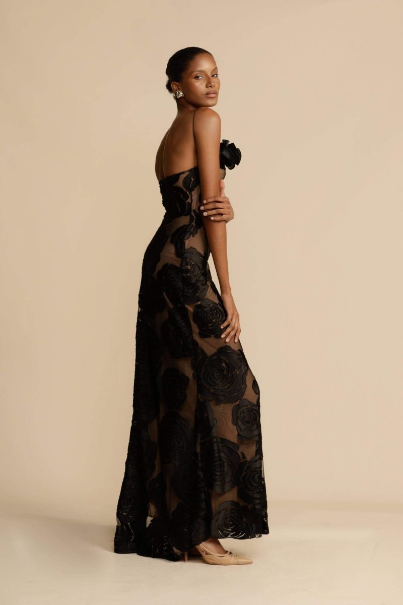 FJØRNA Lindsay floral printed one-shoulder maxi dress in white, flowing design with vibrant floral pattern and elegant silhouette.