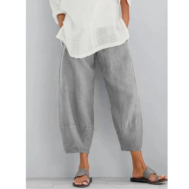 FJØRNA women's lightweight summer dress with tapered harem style, elastic waist, cropped length, perfect for warm weather.