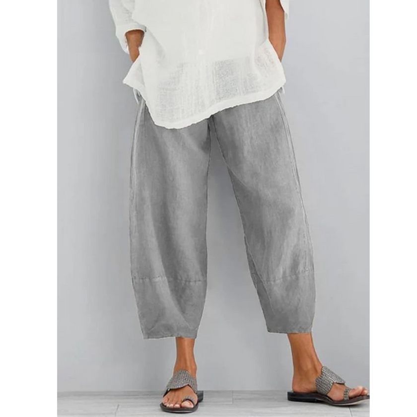 FJØRNA women's lightweight summer dress with tapered harem style, elastic waist, cropped length, perfect for warm weather.