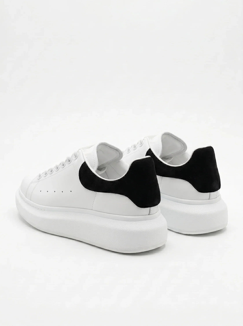 FJØRNA men's white lace-up trainers with minimalist design, back view showing sleek style and comfortable sole for everyday wear.