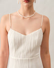 FJØRNA white pearl-strap textured midi dress with wave pattern, perfect for cocktail and special occasions.
