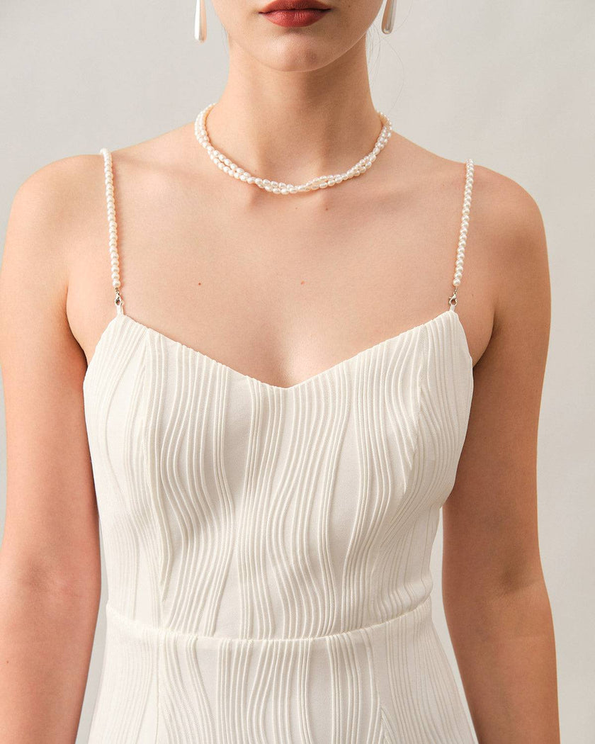 FJØRNA white pearl-strap textured midi dress with wave pattern, perfect for cocktail and special occasions.