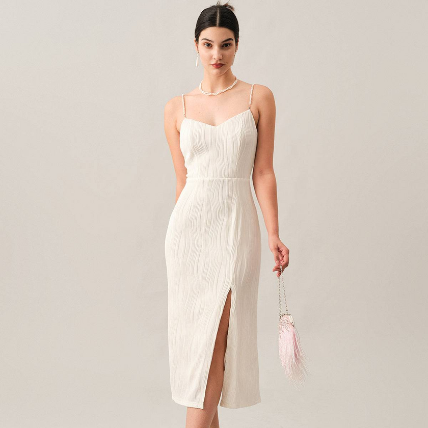 White pearl-strap textured midi dress by FJØRNA, stylish for cocktail and special occasions, featuring elegant fabric details.