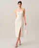 White pearl-strap textured midi dress by FJØRNA, stylish occasion dress with elegant wave pattern and sophisticated design.